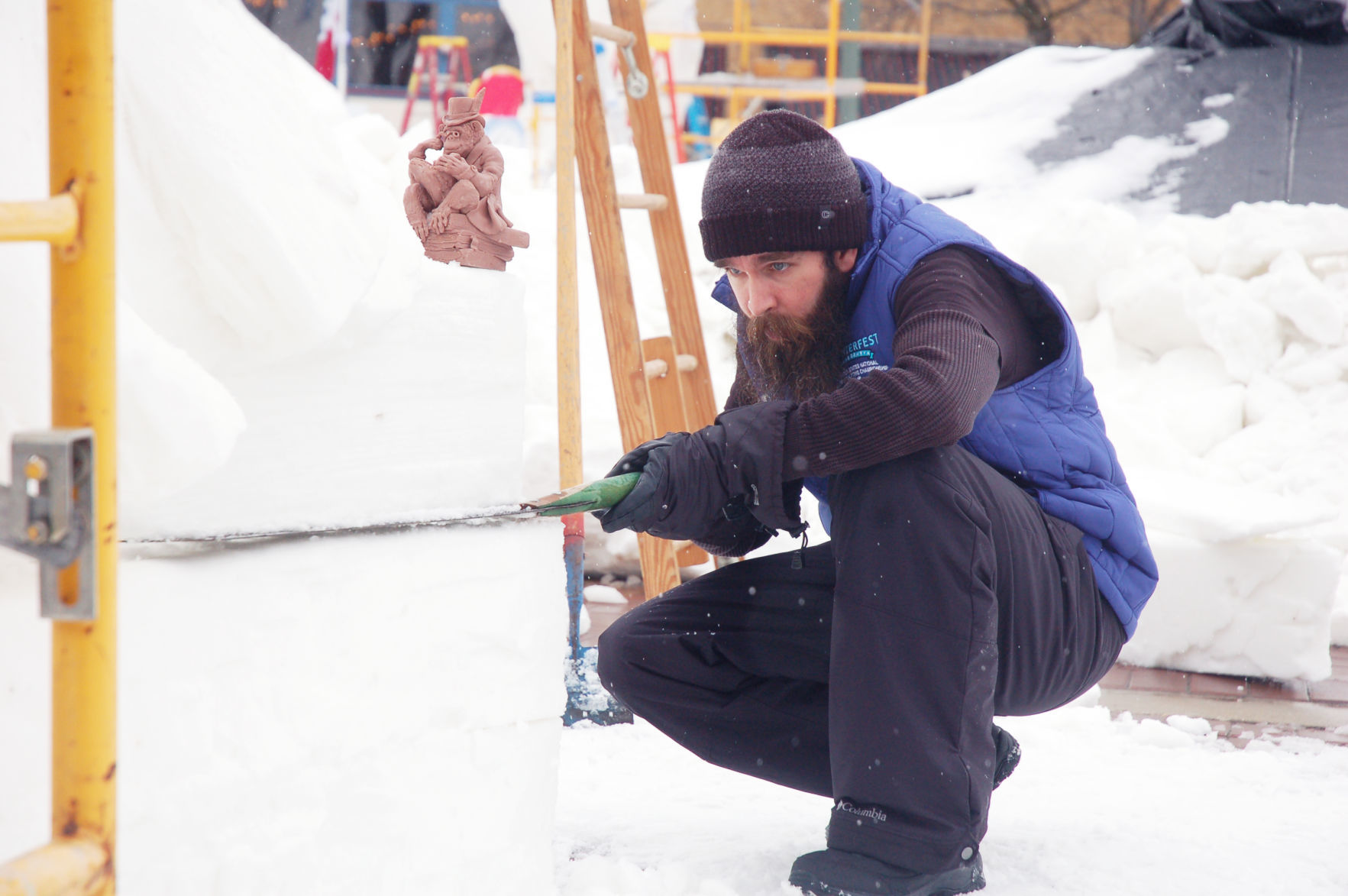Snow sculptor from New Hampshire uses saw